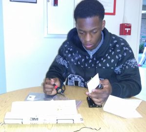 Team B3AST member makes repairs